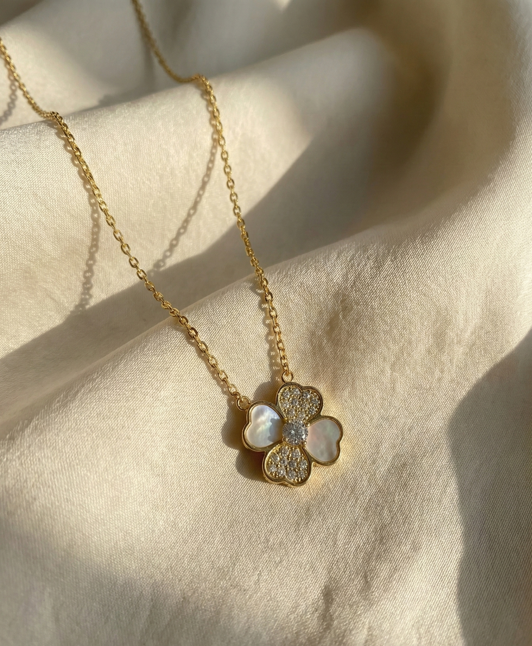 Radiant Bloom Clover Pendant